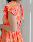 Musselin Kleid, rückenfrei, ärmellos, Palmenblätter, Neon-Orange