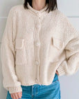 Strickjacke, mit aufgesetzten Taschen, Cremeweiß
