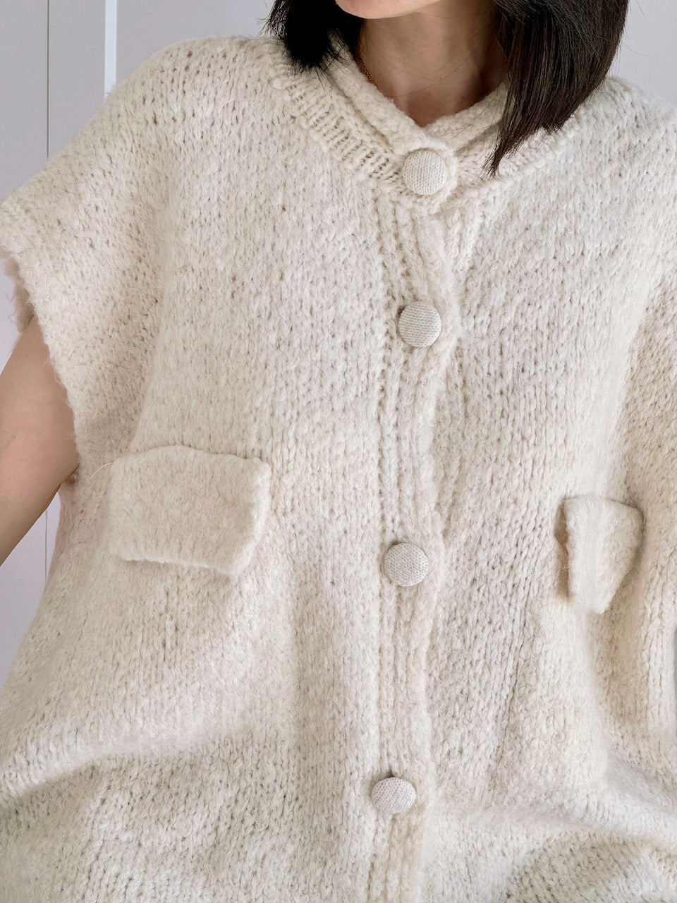 Strickweste, mit aufgesetzten Taschen, Cremeweiß