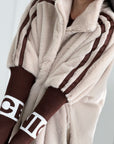 Kunstfell-Jacke mit Strickärmeln, Beige