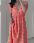 Musselin Kleid, rückenfrei, ärmellos, Palmenblätter, Neon-Orange